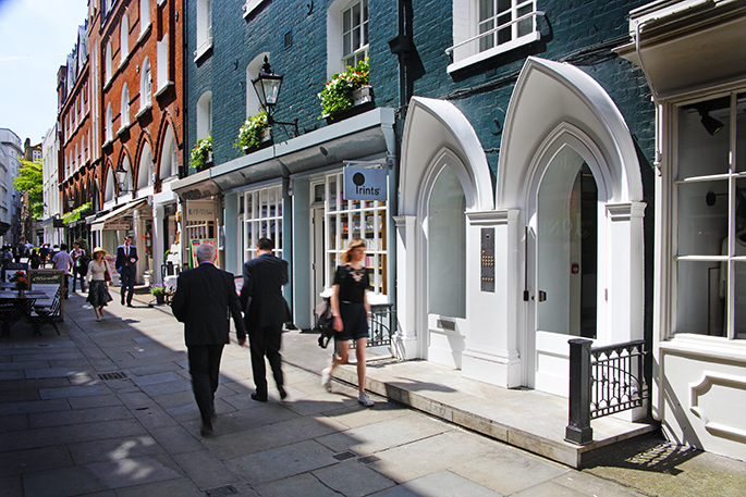 woman walking past shop